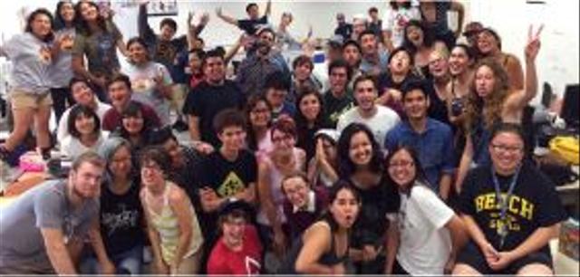 Happy students cheering in classroom